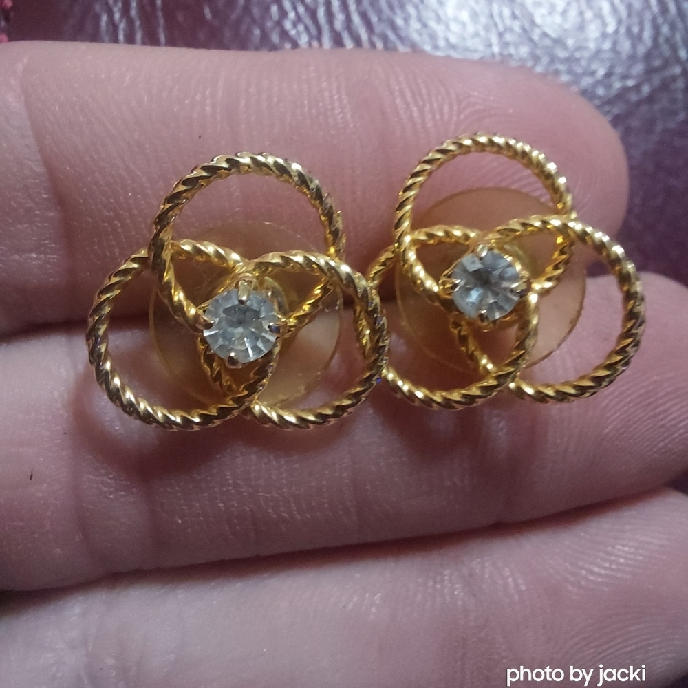 Gold tone earrings with clear stone